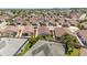 High-angle view of a well-planned residential area with tidy landscaping and uniform home designs that promote community appeal at 2403 Muirwood Pl, The Villages, FL 32162