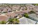 Elevated view of a residential neighborhood with neat homes and gardens, enhanced by mature trees for a serene living environment at 2403 Muirwood Pl, The Villages, FL 32162