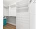 Bright walk-in closet with rods, shelves and storage at 2403 Muirwood Pl, The Villages, FL 32162