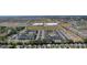 This aerial shot captures the neighborhood and the surrounding commercial establishments at 2482 Ansley Path, The Villages, FL 32162
