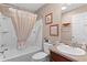 Bathroom with shower and tub combo, single vanity, and neutral color palette at 2482 Ansley Path, The Villages, FL 32162