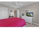 Bedroom with neutral tones and a view of the outside at 2482 Ansley Path, The Villages, FL 32162