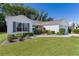 Charming home featuring landscaped front yard, well-manicured lawn, and inviting curb appeal at 2482 Ansley Path, The Villages, FL 32162