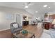 Living room area with access to the dining room, kitchen, and den at 2482 Ansley Path, The Villages, FL 32162