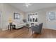 Living room with hardwood floors, white trim and vaulted ceilings at 2482 Ansley Path, The Villages, FL 32162