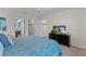 Comfortable main bedroom showcasing ceiling fan, and access to an ensuite bathroom and walk-in closet at 2482 Ansley Path, The Villages, FL 32162