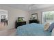 Comfortable main bedroom showcasing ceiling fan, and access to an ensuite bathroom and walk-in closet at 2482 Ansley Path, The Villages, FL 32162