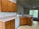 A partial view of the kitchen with a stainless-steel sink and white dishwasher at 25801 Belle Helene, Leesburg, FL 34748