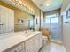 Bathroom with white vanity, updated shower, and neutral tones offer a clean, modern space at 27027 Old English Ct, Leesburg, FL 34748