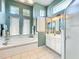 Bathroom with soaking tub and walk-in shower at 27027 Old English Ct, Leesburg, FL 34748