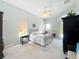 Primary bedroom featuring carpet floors and neutral paint at 27027 Old English Ct, Leesburg, FL 34748