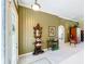 Spacious foyer featuring a leaded glass front door, tile floors, and decorative accents at 27027 Old English Ct, Leesburg, FL 34748