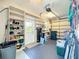 Garage with shelving and storage solutions at 27027 Old English Ct, Leesburg, FL 34748
