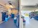 Spacious two car garage featuring built in storage, an epoxy floor and garage door openers at 27027 Old English Ct, Leesburg, FL 34748