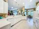Bright kitchen with white countertops and cabinets overlooking breakfast nook at 27027 Old English Ct, Leesburg, FL 34748