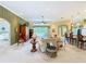 Cozy living room featuring comfortable seating, neutral tones, and a seamless flow to other areas at 27027 Old English Ct, Leesburg, FL 34748