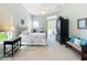 Bright main bedroom features a walk-out to the pool area at 27027 Old English Ct, Leesburg, FL 34748