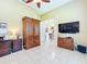 Bright office featuring tile floors, a ceiling fan and TV at 27027 Old English Ct, Leesburg, FL 34748