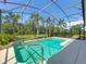 Inviting screened-in pool offers a refreshing escape with a convenient access ladder at 27027 Old English Ct, Leesburg, FL 34748
