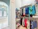 A spacious walk-in closet offers plenty of storage at 27027 Old English Ct, Leesburg, FL 34748