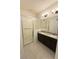 Beautiful bathroom featuring a large glass shower with a seat, double sinks, and modern lighting at 2721 Picasso Ct, Kissimmee, FL 34743