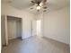 Spacious bedroom with tiled floors, an open closet, and access to an adjoining room at 2721 Picasso Ct, Kissimmee, FL 34743