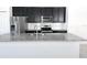 Close up of Kitchen island featuring granite countertops, stainless steel appliances, and white backsplash at 2721 Picasso Ct, Kissimmee, FL 34743