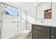 Modern bathroom featuring a glass-enclosed shower, modern vanity and fixtures at 27510 Discover Ct, Leesburg, FL 34748