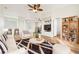 Well staged and decorated living room with a ceiling fan and new hardwood floors at 27510 Discover Ct, Leesburg, FL 34748