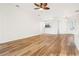 Bright living room with hardwood floors and an open floor plan at 27510 Discover Ct, Leesburg, FL 34748