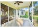 Enclosed sunroom with ceiling fan and access to beautiful backyard at 27510 Discover Ct, Leesburg, FL 34748