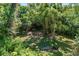 Spacious, green backyard offering a serene and private outdoor space, perfect for relaxation and nature enjoyment at 306 N Clayton St, Mount Dora, FL 32757