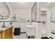 A stylish bathroom with black and white tile floors, and modern fixtures at 306 N Clayton St, Mount Dora, FL 32757