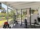 Outdoor gym area with workout equipment, a weight rack, and a view of the surrounding landscape at 306 N Clayton St, Mount Dora, FL 32757