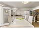 Kitchen with white cabinets, dining table, and lots of counter space at 306 N Clayton St, Mount Dora, FL 32757