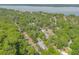 Stunning aerial view of home surrounded by lush greenery and waterfront scenery at 3075 Cr 431N, Lake Panasoffkee, FL 33538