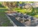 Backyard setting with unique outdoor table and seating area at 3075 Cr 431N, Lake Panasoffkee, FL 33538