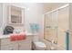 Well-maintained bathroom with tiled shower, matching fixtures and vanity at 3075 Cr 431N, Lake Panasoffkee, FL 33538
