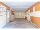 Spacious two car garage equipped with shelving and ample storage space at 3075 Cr 431N, Lake Panasoffkee, FL 33538
