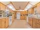 Expansive kitchen with ample cabinet space and modern appliances at 3075 Cr 431N, Lake Panasoffkee, FL 33538