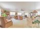 Open floor plan showing the living room with seating area adjacent to the dining table at 3075 Cr 431N, Lake Panasoffkee, FL 33538