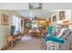 Inviting living area with dining table, comfortable seating, and display cabinet for cherished items at 3075 Cr 431N, Lake Panasoffkee, FL 33538