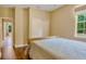 Bedroom features light-colored walls, wood floors, bed, and closet at 31728 Nutmeg Ave, Eustis, FL 32736