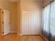Bedroom featuring modern floors and a closet with double doors, bathed in natural light at 31728 Nutmeg Ave, Eustis, FL 32736