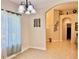 Well-lit dining area with tile flooring, chandelier lighting and neutral paint at 31728 Nutmeg Ave, Eustis, FL 32736