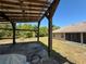 The exterior features a covered patio with solar panels and a view of the home and lawn at 31728 Nutmeg Ave, Eustis, FL 32736