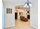 Comfortable living room viewed from the dining area; includes tile flooring and neutral walls at 31728 Nutmeg Ave, Eustis, FL 32736