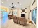 Spacious living room with a large fan, comfortable seating, and ample natural light at 31728 Nutmeg Ave, Eustis, FL 32736