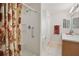Bright bathroom featuring a walk-in shower and a wood vanity with a mirror at 3294 Shelby St, The Villages, FL 32162
