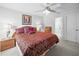 Bright bedroom featuring a comfortable bed and access to an adjoining bathroom, creating a serene retreat at 3294 Shelby St, The Villages, FL 32162